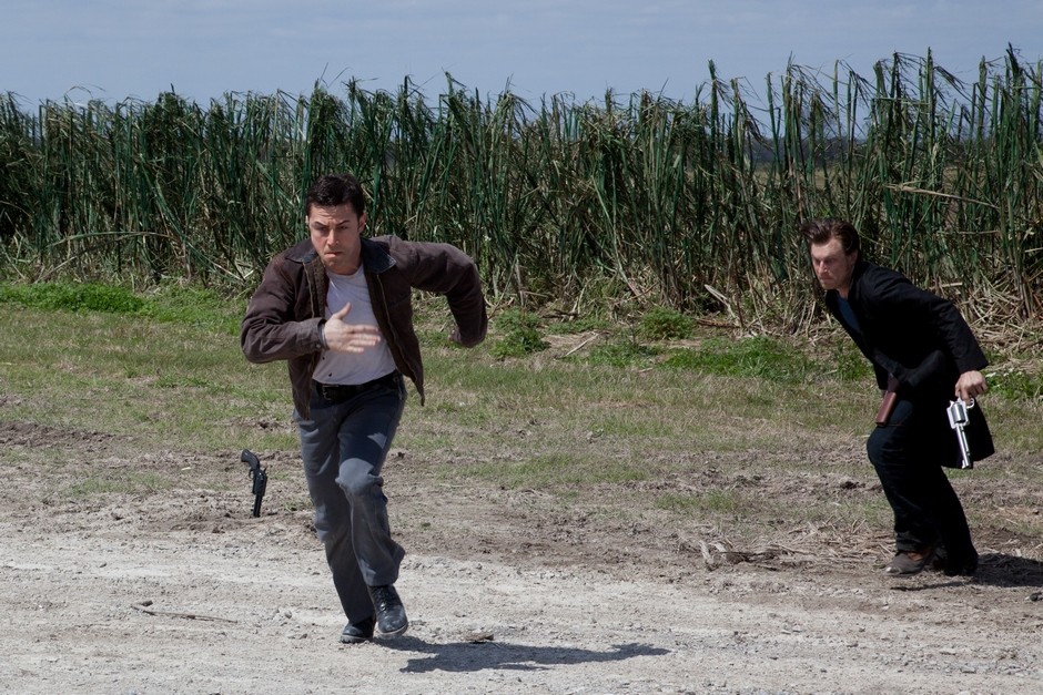 Joseph Gordon-Levitt stars as Joe and Noah Segan stars as Kid Blue in TriStar Pictures' Looper (2012)