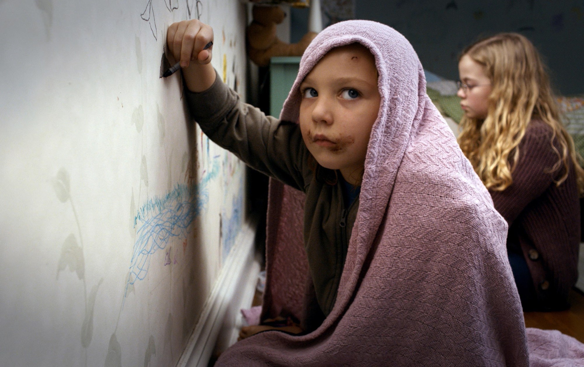 Isabelle Nelisse stars as Lilly and Megan Charpentier stars as Victoria in Universal Pictures' Mama (2013)