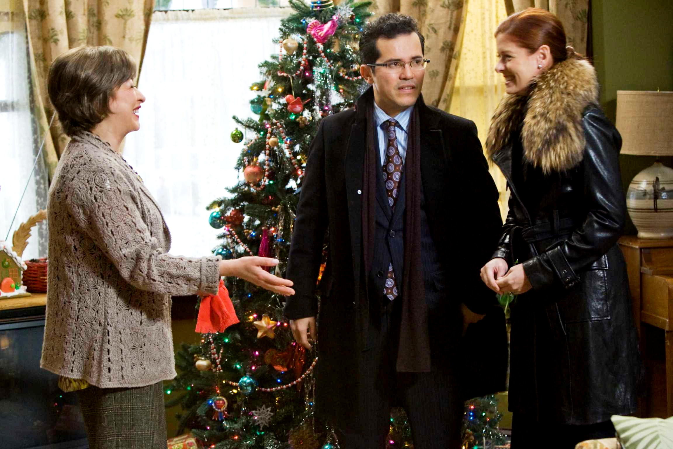 Elizabeth Pena, John Leguizamo and Debra Messing in Overture Films' Nothing Like the Holidays (2008). Photo credit by Chuck Hodes.