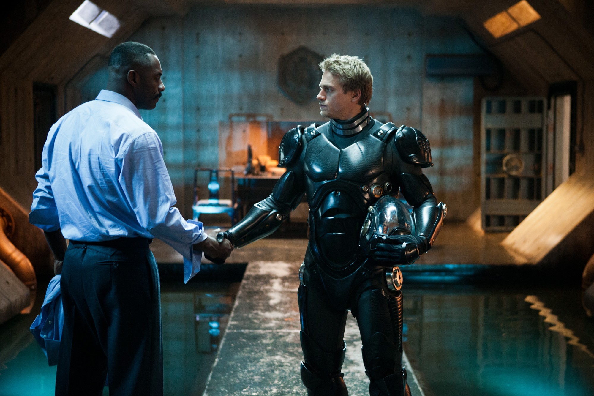 Idris Elba stars as Stacker Pentecost and Charlie Hunnam stars as Raleigh Antrobus in Warner Bros. Pictures' Pacific Rim (2013)