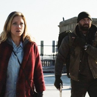 Brittany Snow stars as Lucy and Dave Bautista stars as Stupe in RLJ Entertainment's Bushwick (2017)