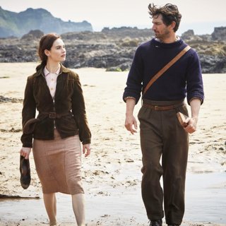 Lily James stars as Juliet Ashton and Michiel Huisman stars as Dawsey Adams in Netflix's The Guernsey Literary and Potato Peel Pie Society (2018)