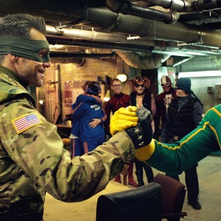 Jim Carrey stars as Colonel Stars and Stripes and Aaron Johnson stars as Dave Lizewski/Kick-Ass in Universal Pictures' Kick-Ass 2 (2013)