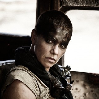 Charlize Theron stars as Imperator Furiosa in Warner Bros. Pictures' Mad Max: Fury Road (2015). Photo credit by Jasin Boland.