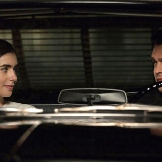 Lily Collins stars as Marla Mabrey and Alden Ehrenreich stars as Frank Forbes in 20th Century Fox's Rules Don't Apply (2016)