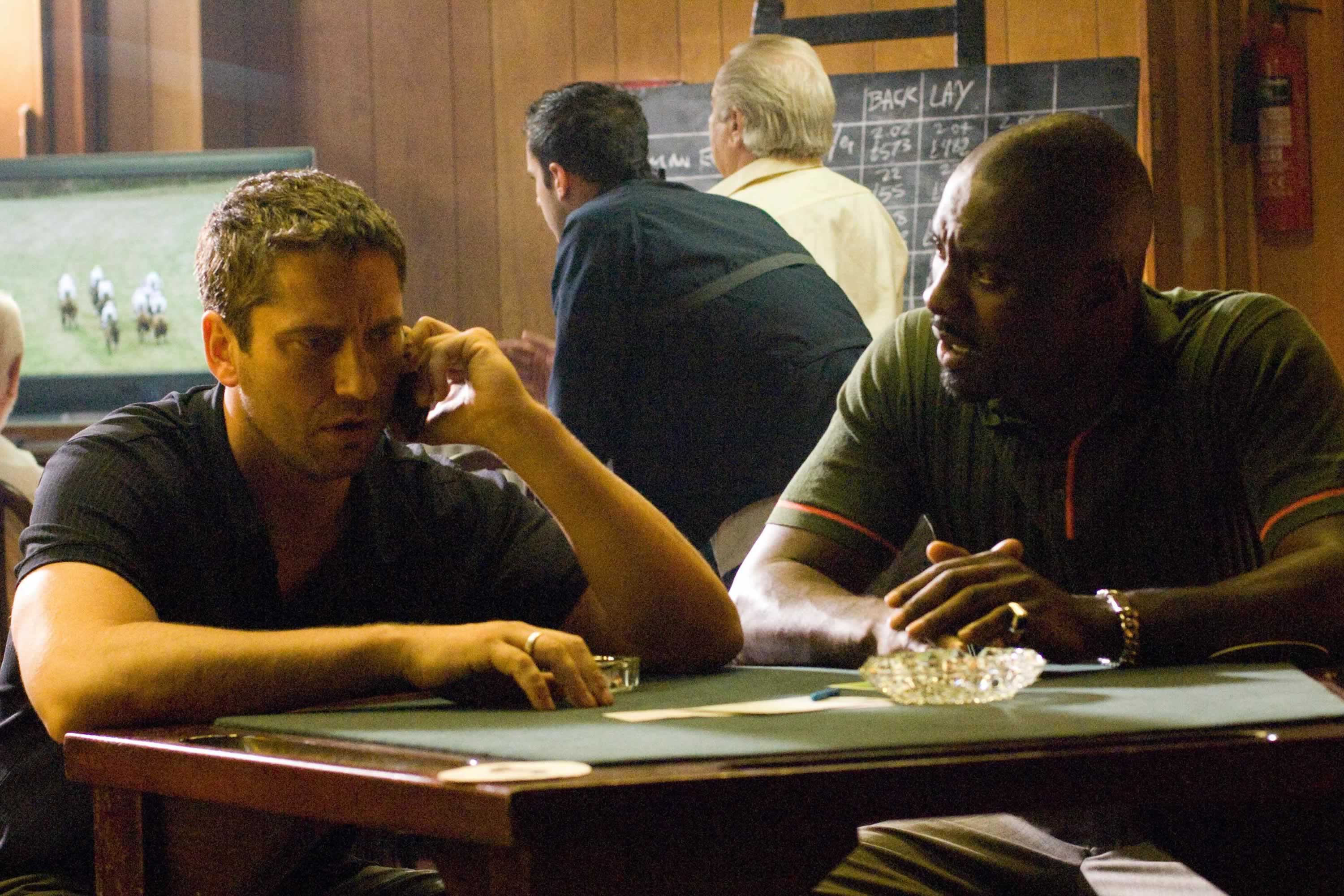 Gerard Butler stars as One Two and Idris Elba stars as Mumbles in Warner Bros Pictures' RocknRolla (2008)