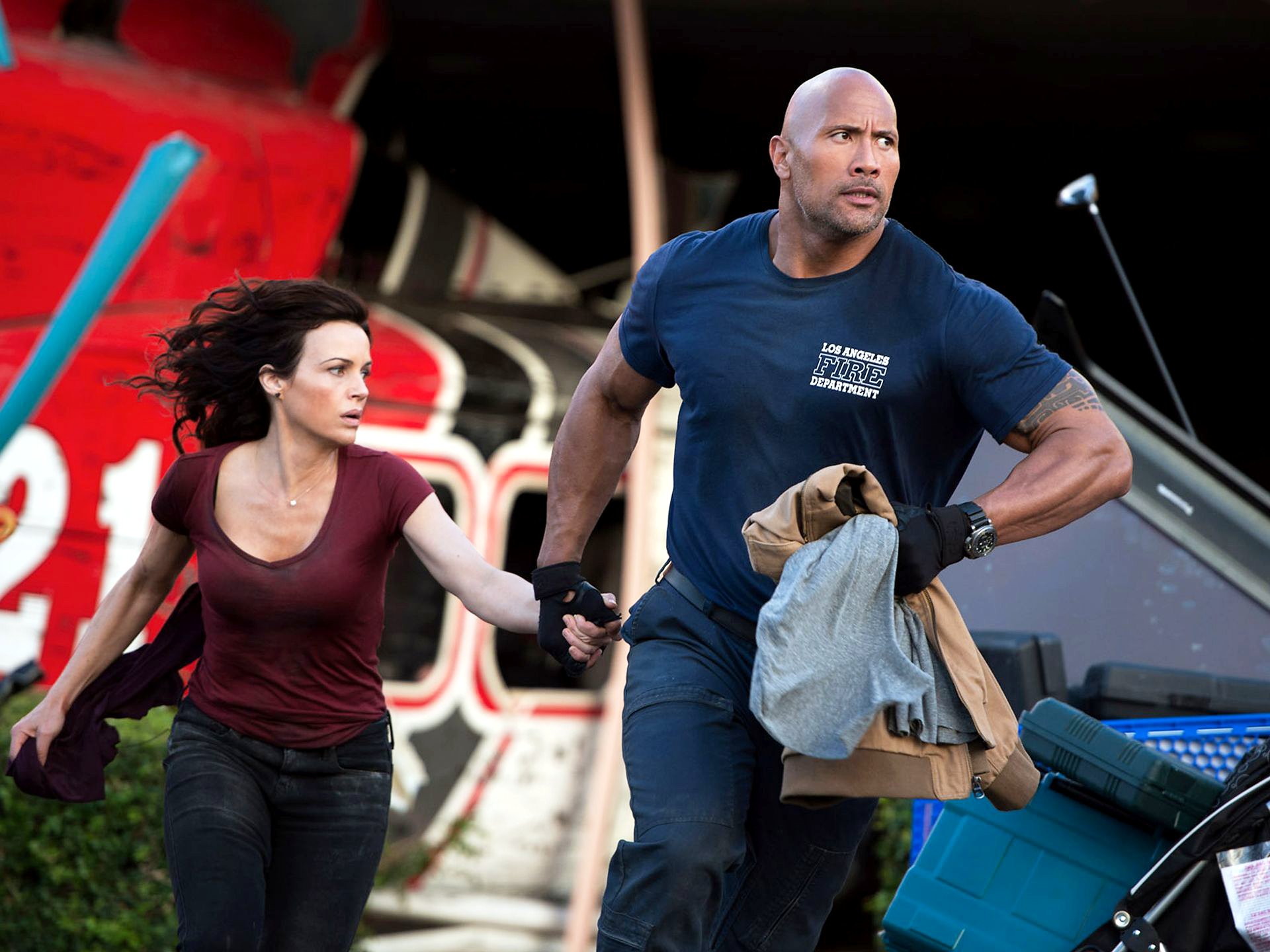 Carla Gugino stars as Emma and The Rock stars as Ray in Warner Bros. Pictures' San Andreas (2015). Photo credit by Jasin Boland.