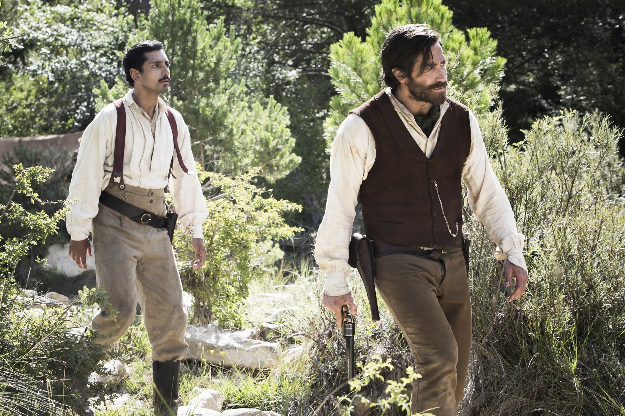 Riz Ahmed stars as Hermann Kermit Warm and Jake Gyllenhaal stars as Morris in Annapurna Pictures' The Sisters Brothers (2018)