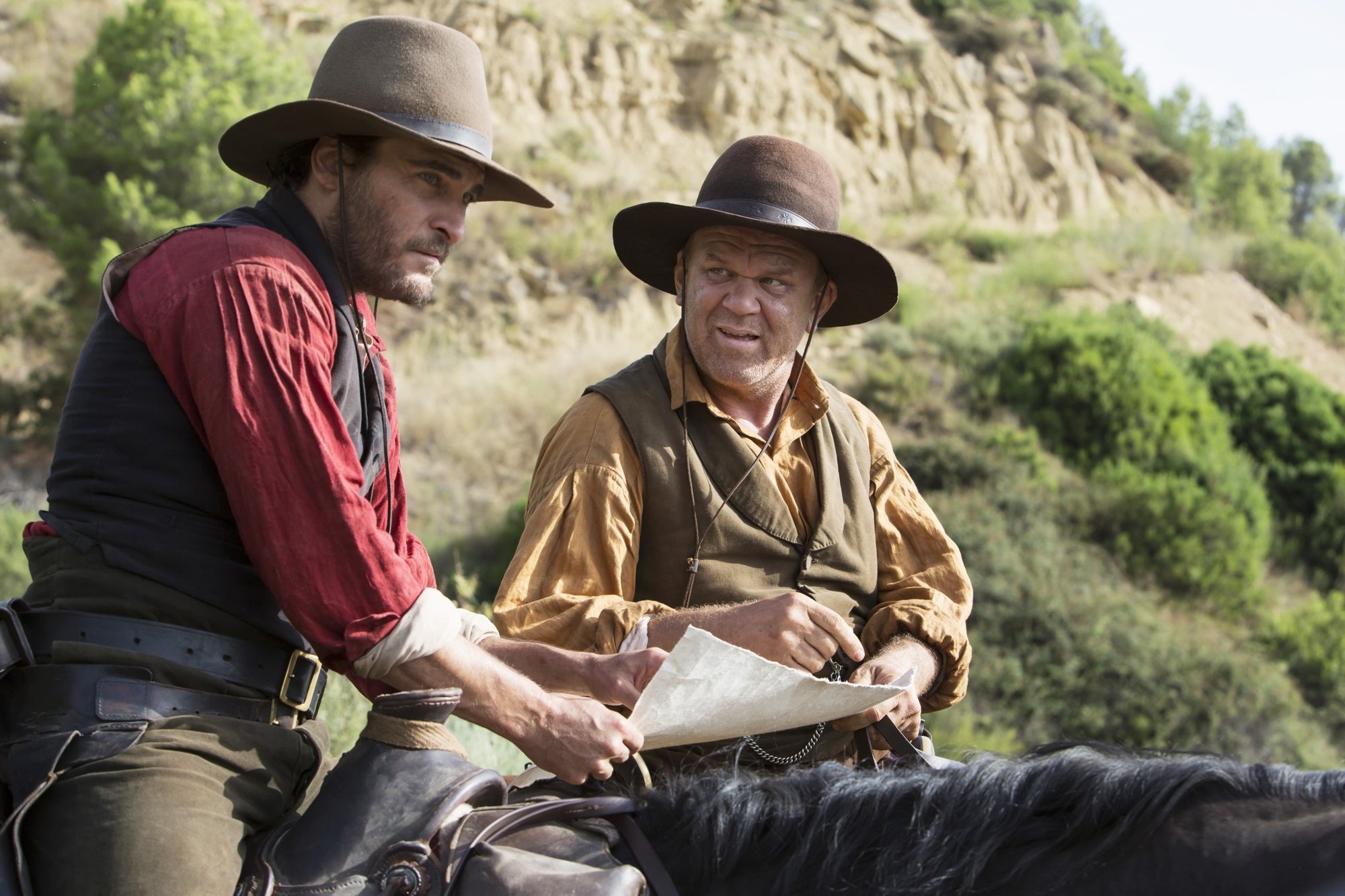 Joaquin Phoenix stars as Charlie Sisters and John C. Reilly stars as Eli Sisters in Annapurna Pictures' The Sisters Brothers (2018)