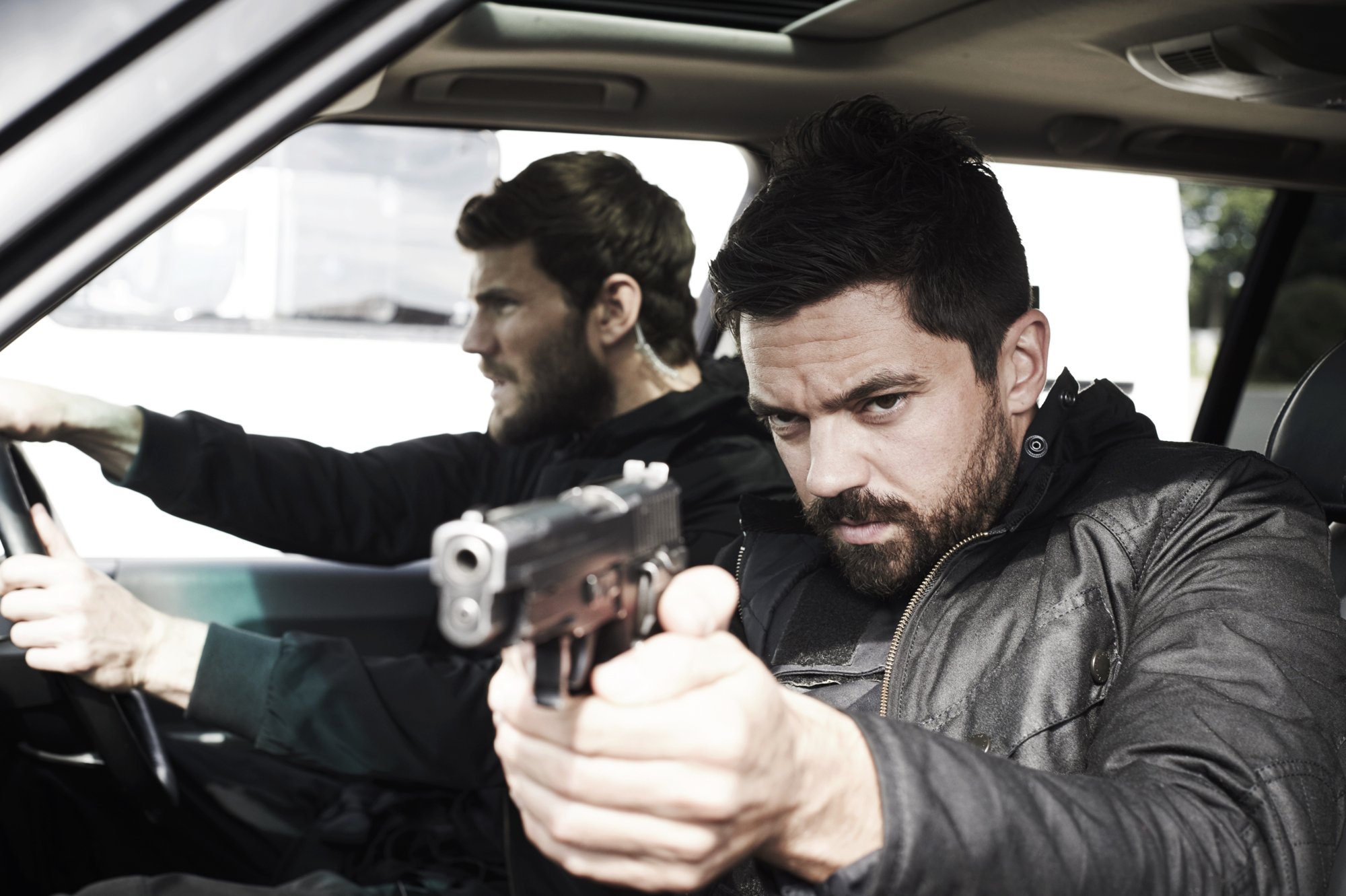 Austin Stowell stars as Hank and Dominic Cooper stars as John Stratton in Momentum Pictures' Stratton (2018)