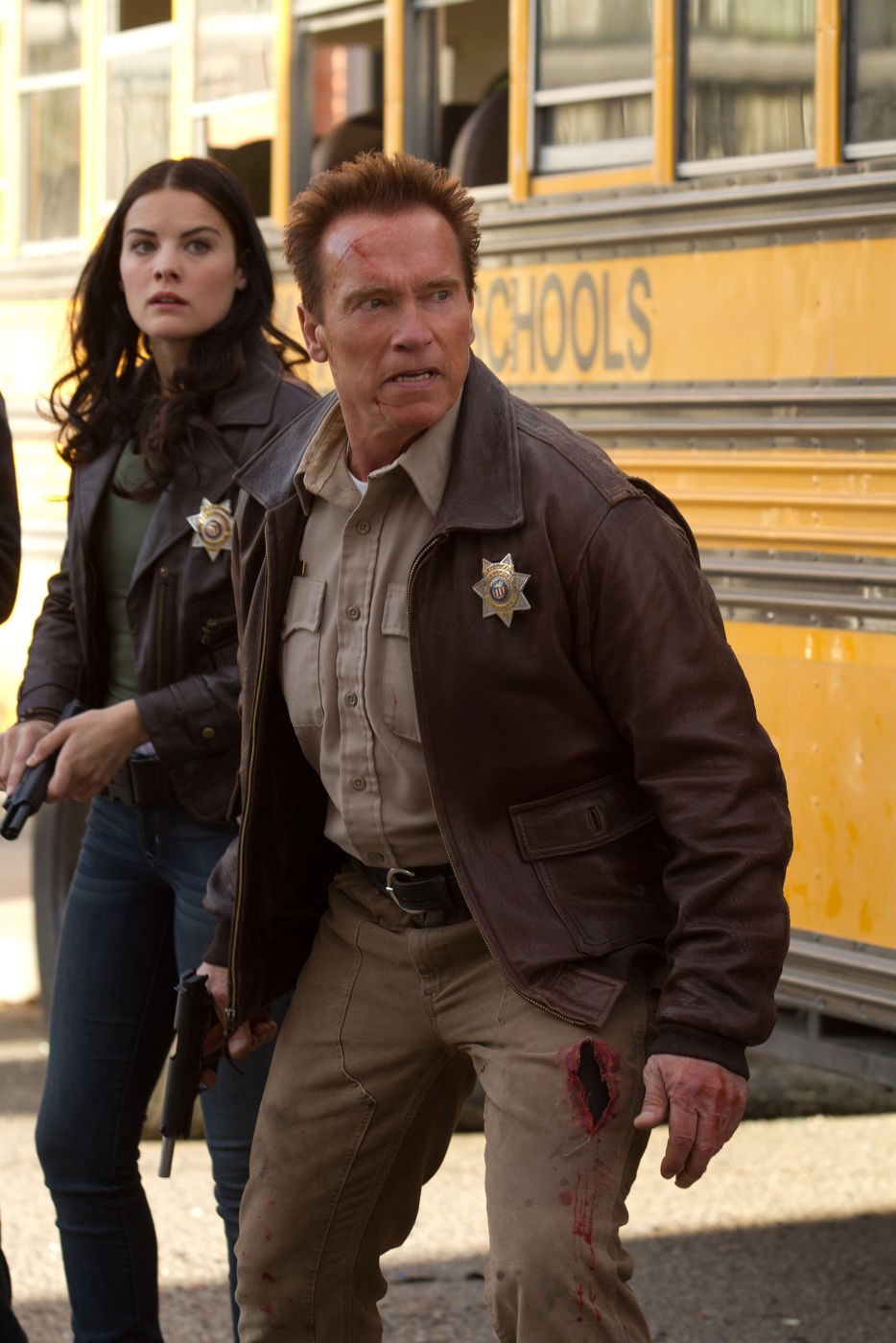 Jaimie Alexander stars as Sarah Torrance and Arnold Schwarzenegger stars as Sheriff Ray Owens in Lionsgate Films' The Last Stand (2013)
