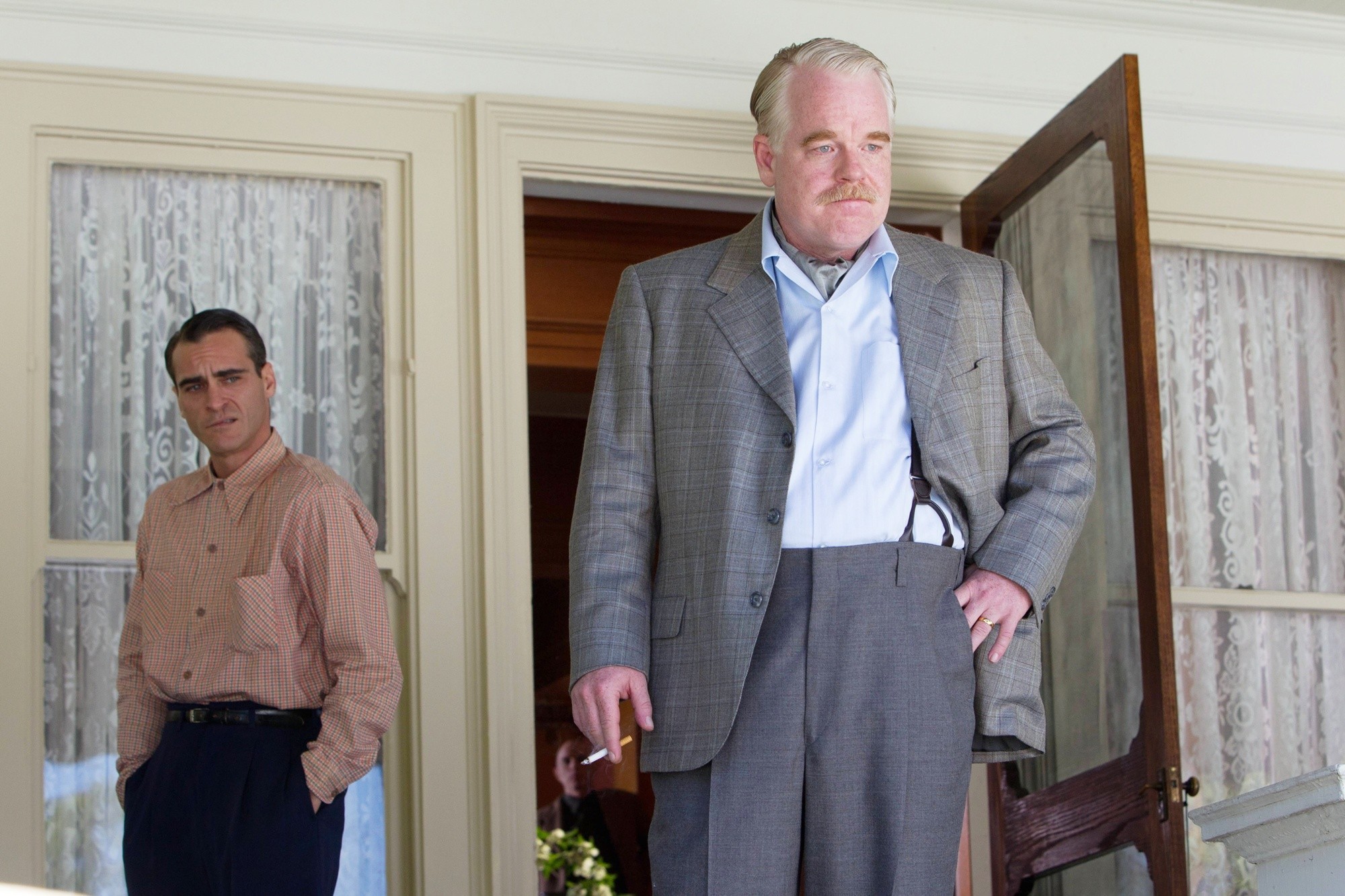 Joaquin Phoenix stars as Freddie Sutton and Philip Seymour Hoffman stars as Lancaster Dodd in The Weinstein Company's The Master (2012)