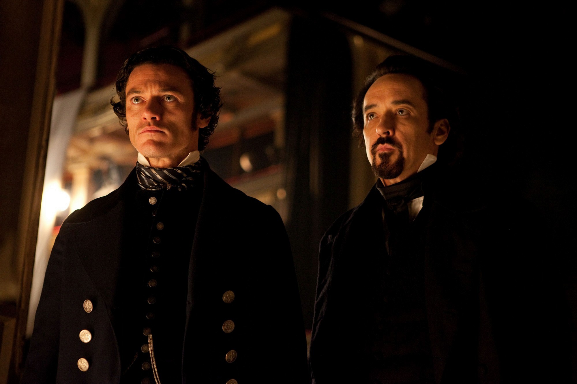 Luke Evans stars as Detective Emmett Fields and John Cusack stars as Edgar Allan Poe in Relativity Media's The Raven (2012)
