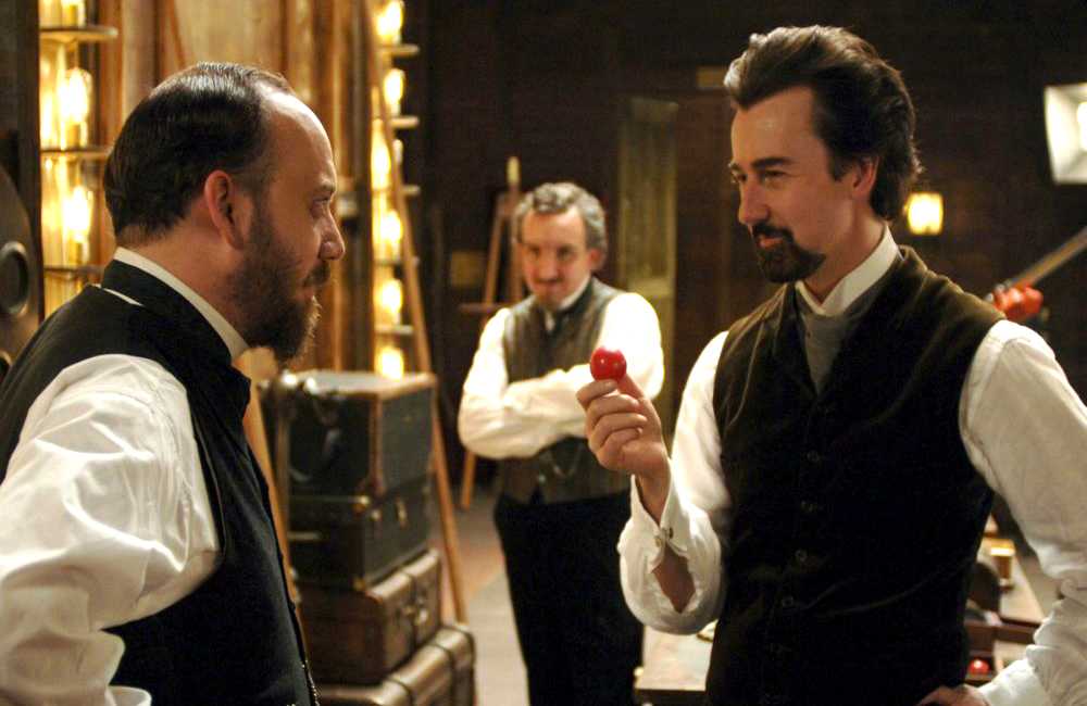 Paul Giamatti as Chief Inspector Uhl and Edward Norton as a magician named Eisenheim in The Illusionist (2006)