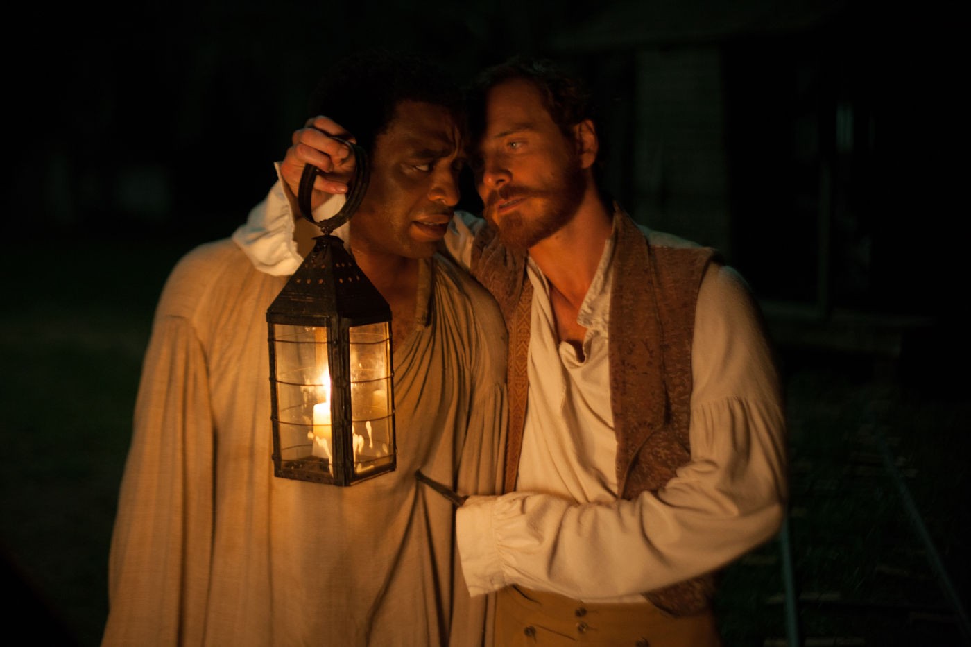 Chiwetel Ejiofor stars as Solomon Northup and Michael Fassbender stars as Edwin Epps in Fox Searchlight Pictures' 12 Years a Slave (2013)