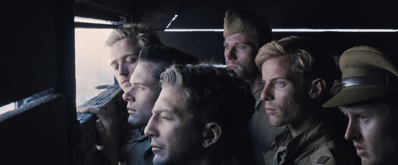 Jack O'Connell stars as Louis Zamperini and Luke Treadaway stars as Miller in Universal Pictures' Unbroken (2014)