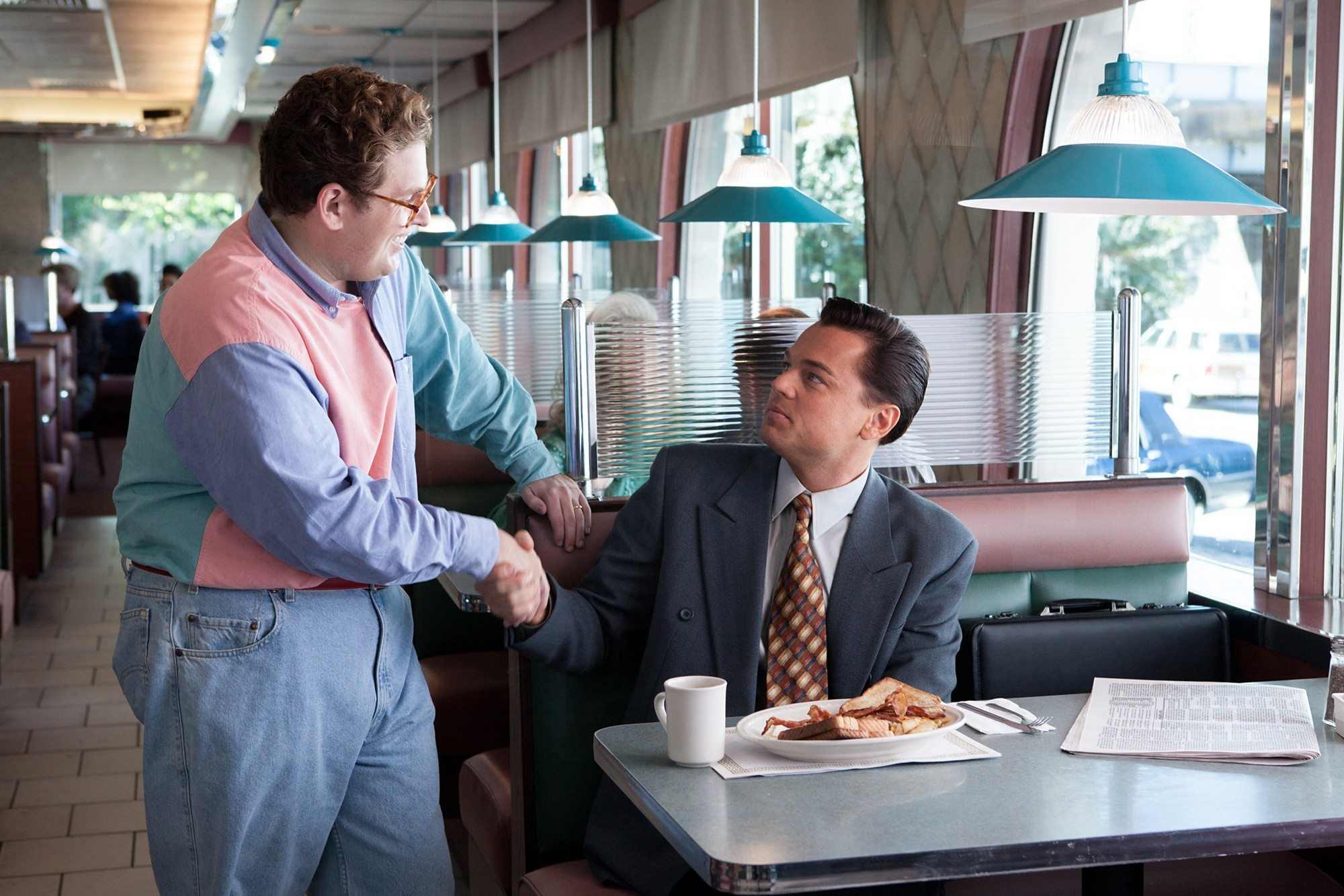 Jonah Hill stars as Donnie Azoff and Leonardo DiCaprio stars as Jordan Belfort in Paramount Pictures' The Wolf of Wall Street (2013)